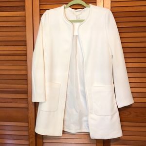 H&M white mid length coat , fashionable.